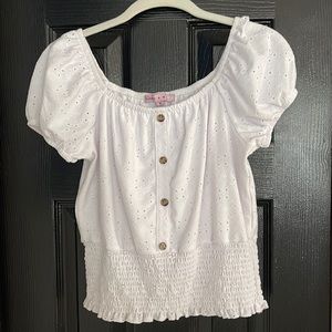White top with eyelet detail, banded bottom. Size medium (12)